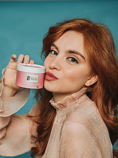 Woman loving Organic Essence certified organic moisturizer